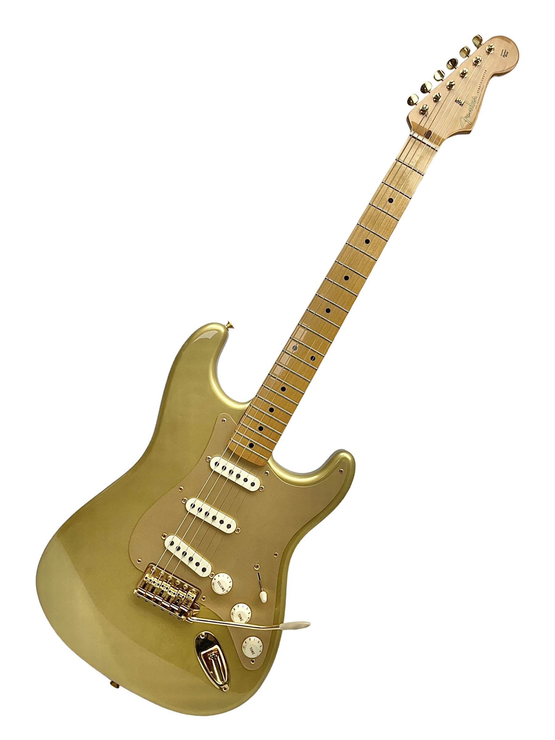 Fender Stratocaster 50th Anniversary 2004 metallic gold electric guitar; serial no.MZ4116369; L98cm; in Spider fitted case with owners manual and other paperwork, strap and belt buckle etc