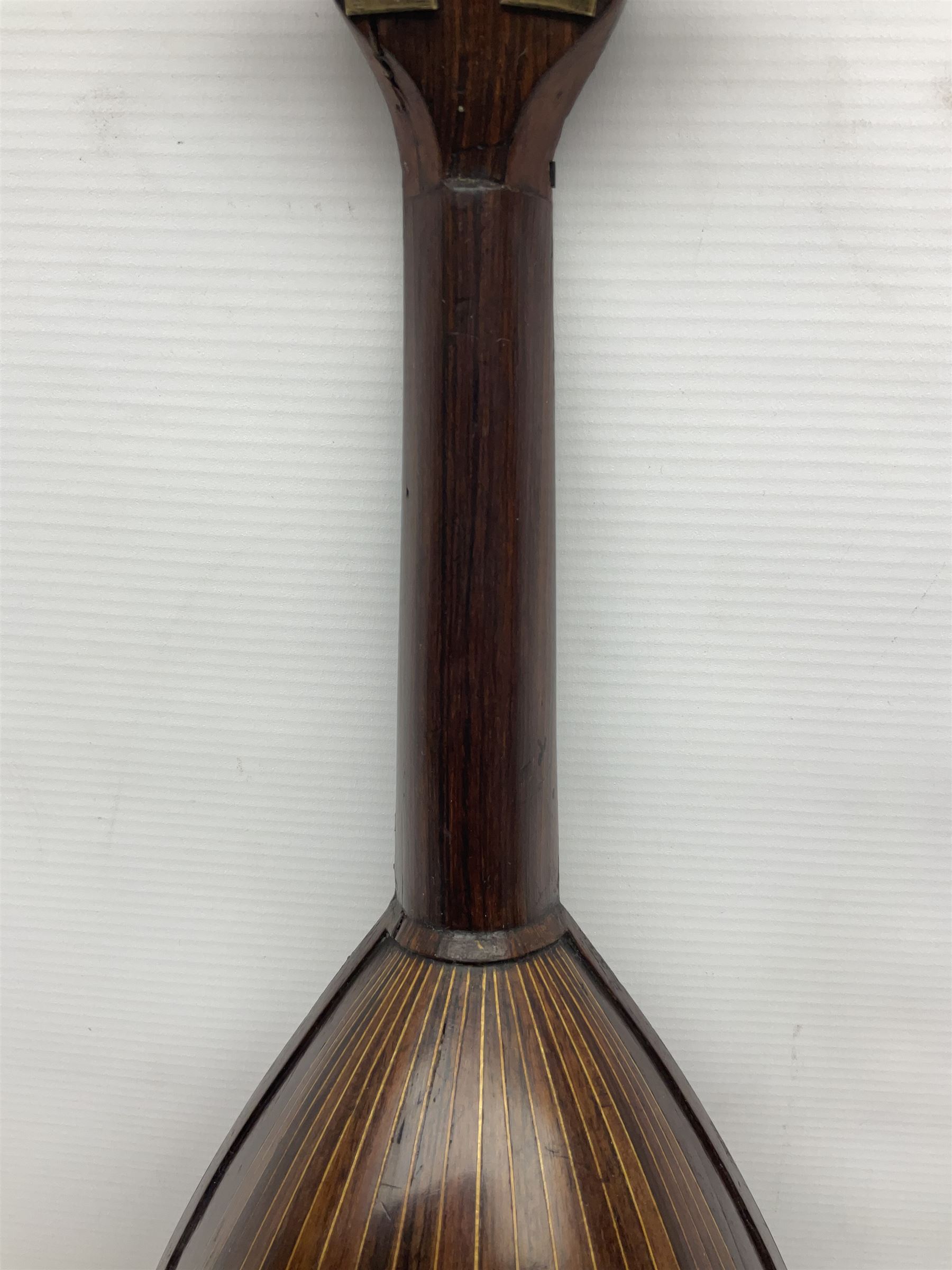 Late 19th century Italian lute back mandolin with segmented bowl back, bears label Gennaro Maglioni Napoli L61cm; in ebonised wooden case; together with another similar damaged Italian lute back mandolin for restoration or spares (2)