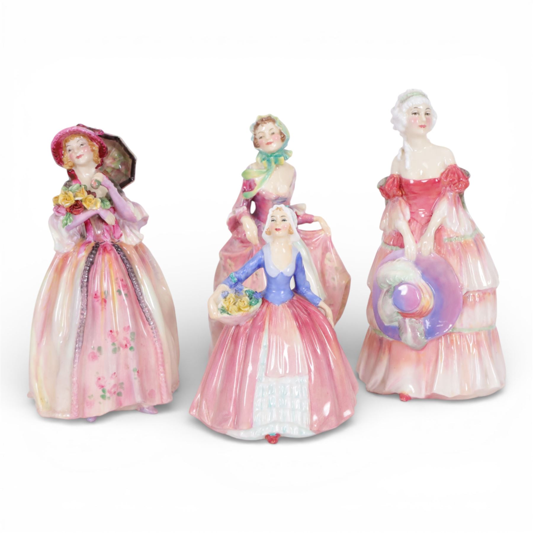 Four Royal Doulton figures, comprising Suzette HN1487, Veronica HN1517, June HN1691 and Janet HN1916