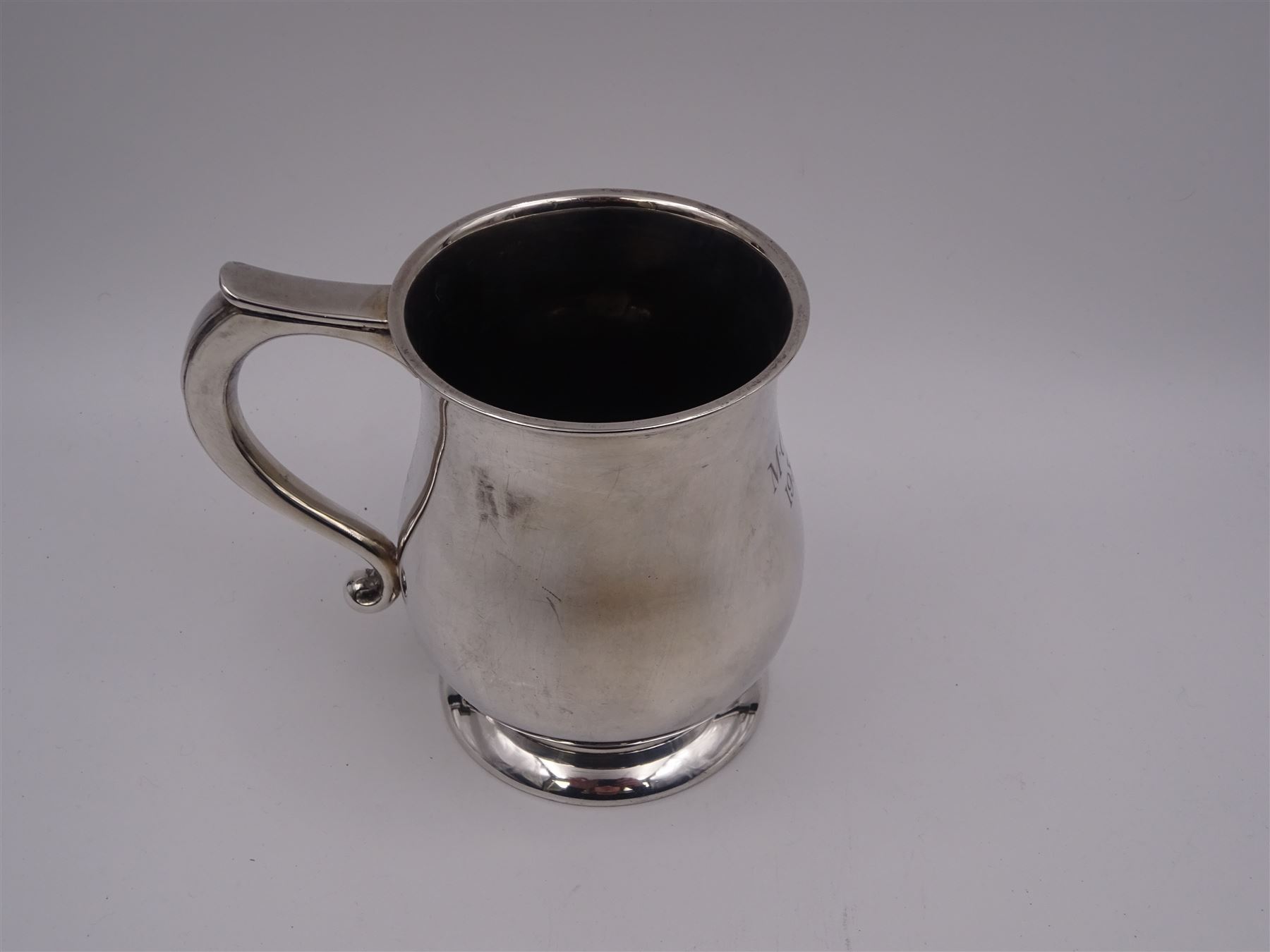 1930s silver tankard, of baluster form, with personalised engraving and C scroll handle, upon spreading circular foot, hallmarked Mappin & Webb Ltd, Sheffield 1938