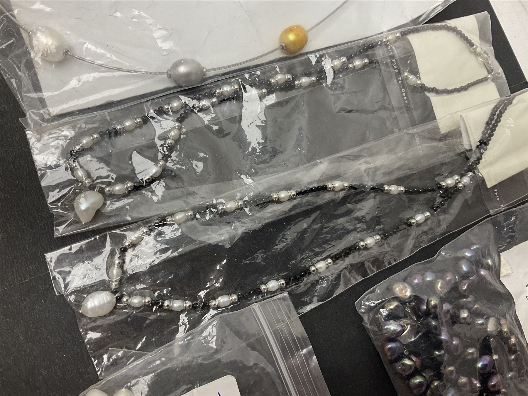 Fresh water pearl jewellery, including silver chain bracelet and necklace, and seven other necklaces, including agate examples, some with silver clasps