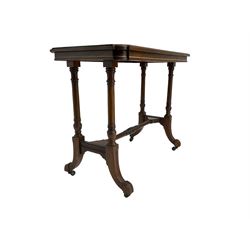 Late Victorian rosewood stretcher table, the rectangular top with curved canted cornice and moulded edge, on quadruple turned pillar supports carved with foliage, joined by collar turned stretcher, on splayed moulded supports with brass and ceramic castors