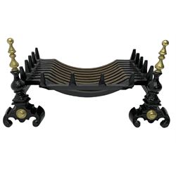 Black painted cast iron and brass fire basket, the andiron of finialed form with scroll feet