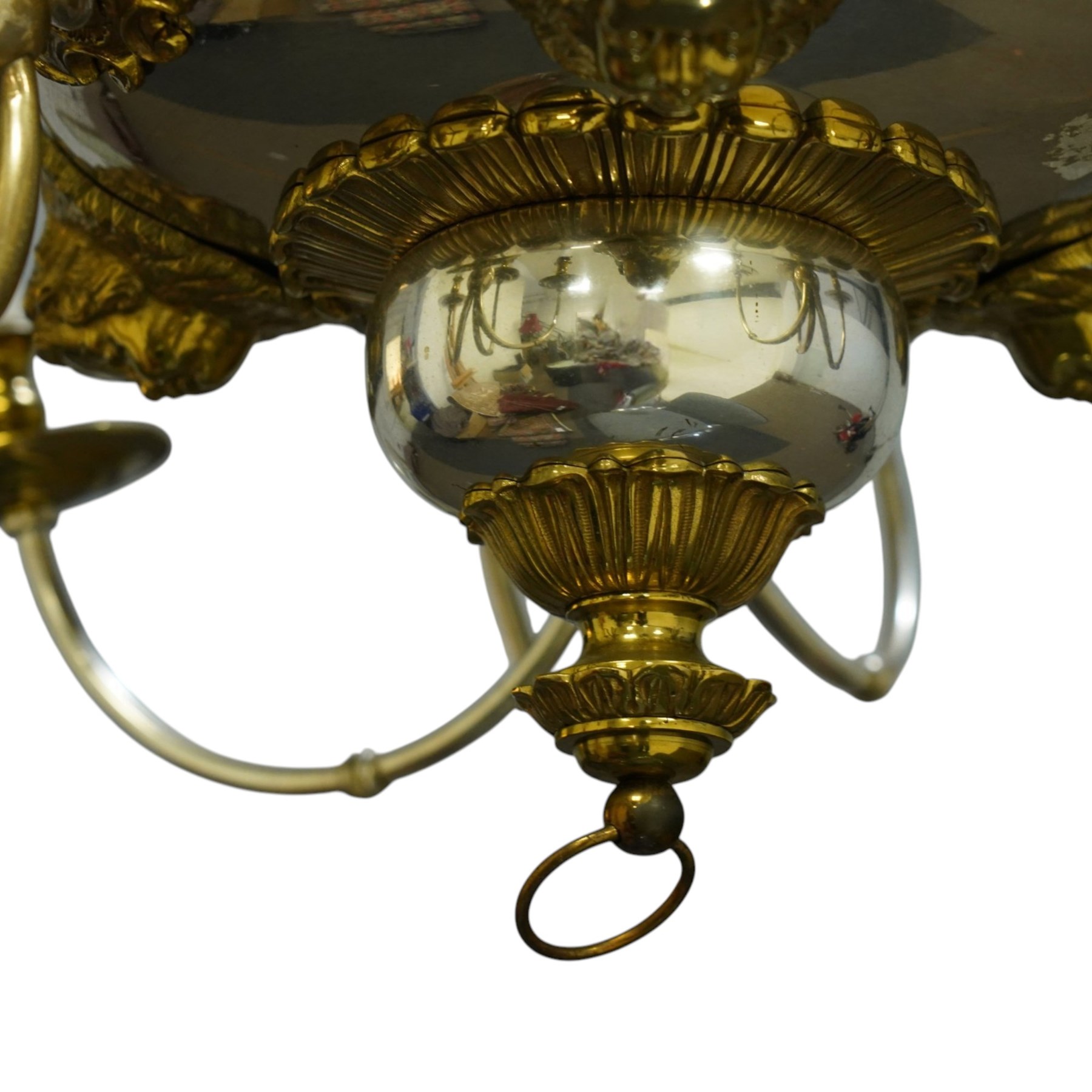 Regency Revival chromium-plated and gilt-brass nine-light chandelier of Neoclassical design, the dished central bowl applied with substantial gilt winged cherub-mask mounts and issuing nine scrolling branches with circular drip pans and faux candle sleeves, over a spherical terminal with gilt-metal gadrooned flower-petal collar and ring, max. diameter 75cm