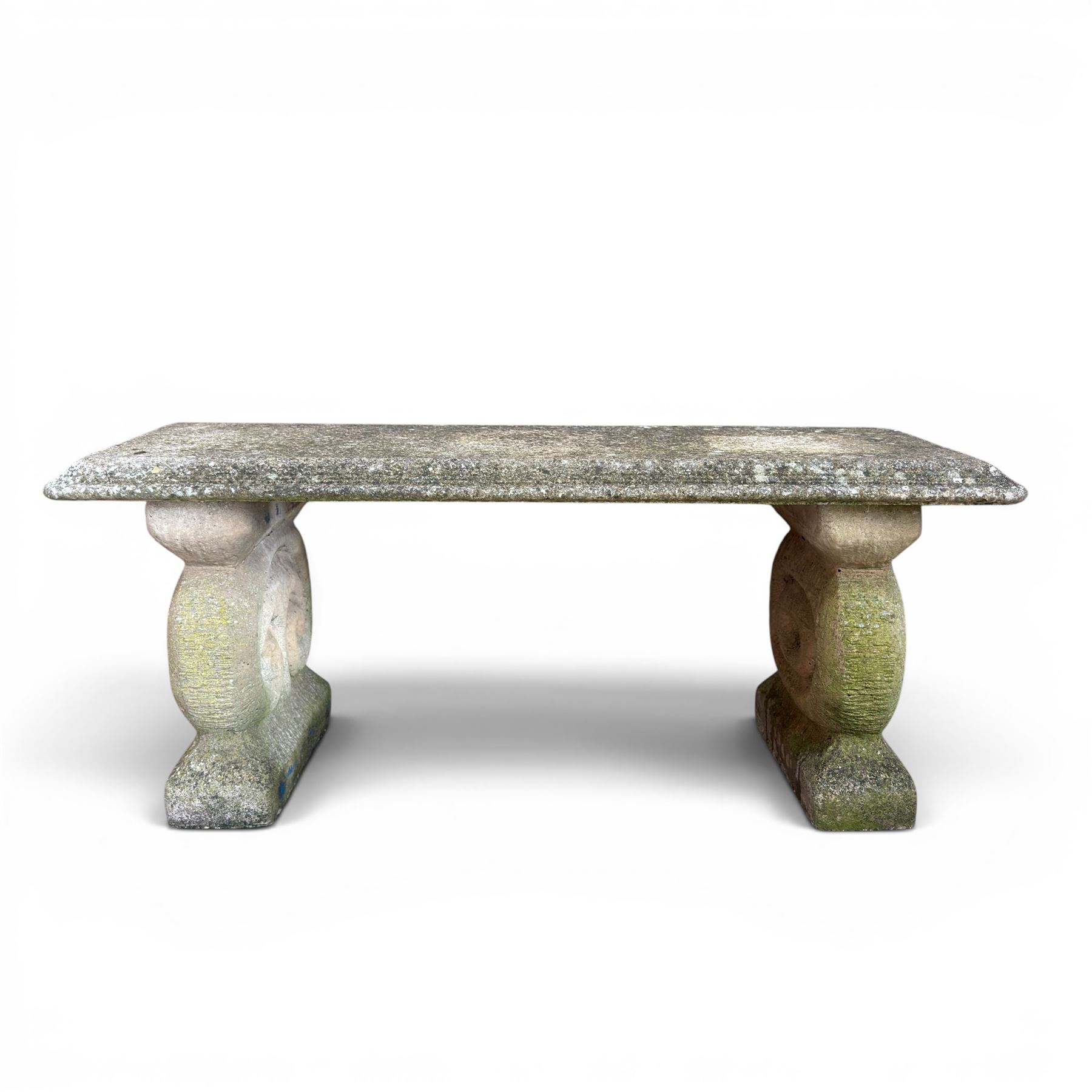 Three piece weathered cast stone garden bench, rectangular top on rounded detailed base