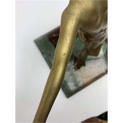 An Art Deco gilt patinated spelter figure, modelled as a dancing female figure, mounted upon a rectangular painted marble effect base, overall H31.5cm, base L28cm. 
