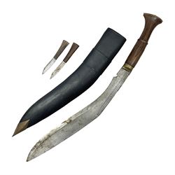 Gurkha Kukri knife with 53cm curving steel blade and wooden handle; in leather covered scabbard with belt loop and two wooden handled skinning knives overall L78cm