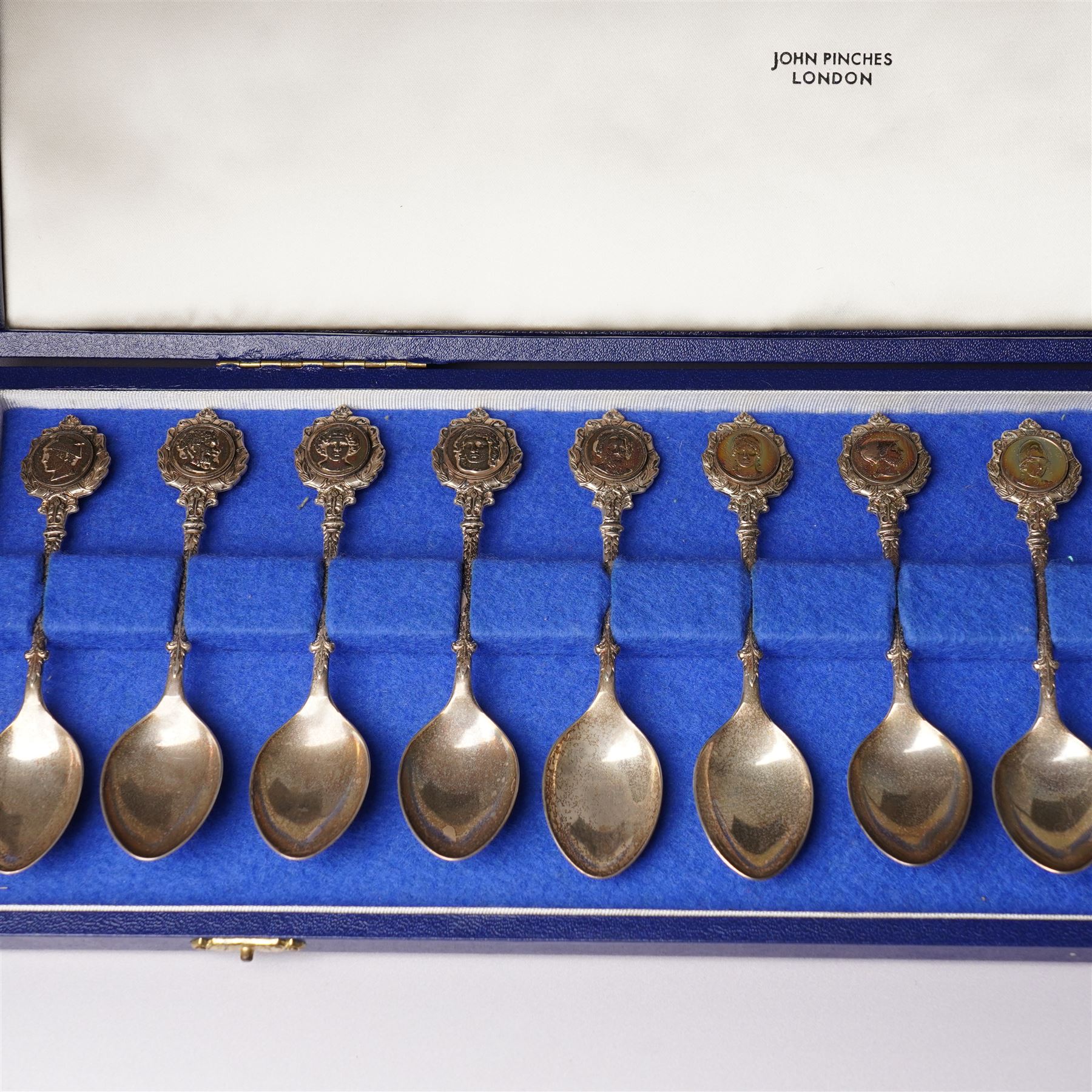 'The Twelve Roman Spoons' a set of twelve silver spoons each with the head of a Deity in fitted case London 1971 Maker John Pinches