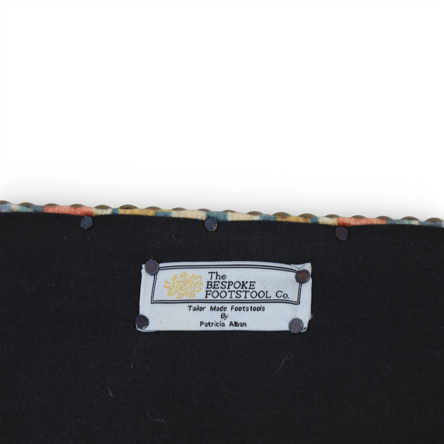 Pair of needlepoint footstools, retailed by The Bespoke Footstool Co, brass studded trim on tapered oak supports