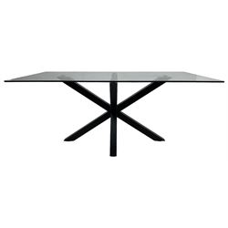 Contemporary glass and metal dining table, rectangular glass top on black finish steel X-framed base