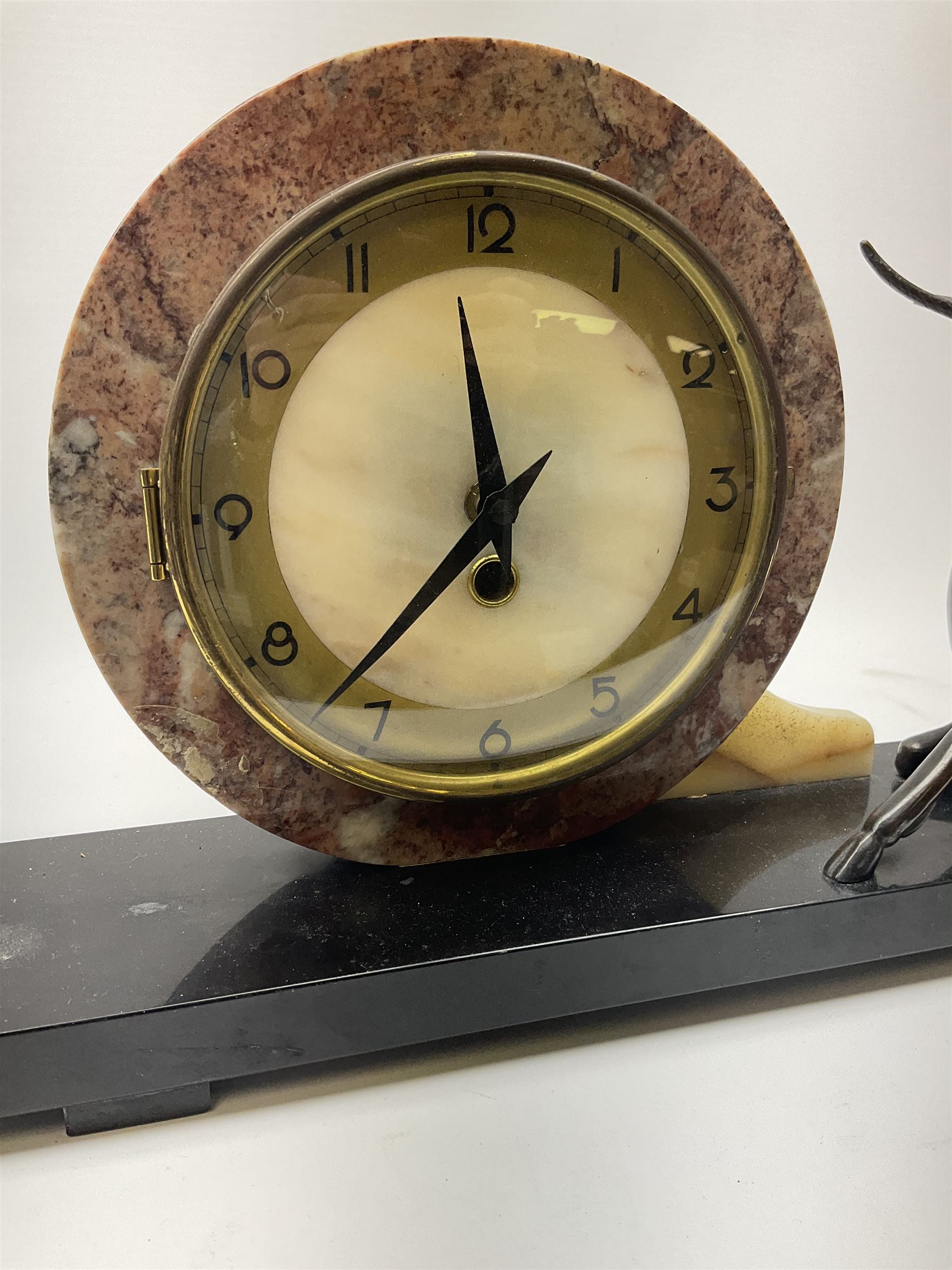 Art Deco style marble and anodised spelter three-piece clock garniture, model with recumbent gazelle, centre piece L52cm.  