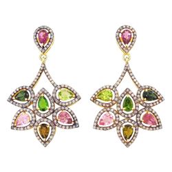 Pair of silver and silver-gilt tourmaline and diamond earrings, each stud set with seven p...
