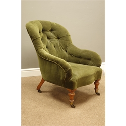  Victorian iron framed tub shaped armchair, upholstered in deep buttoned green velvet, turned walnut feet with brass cups and castors  