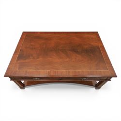 Georgian style mahogany coffee table, rectangular moulded top with crossbanded border and line inlay, fitted with two cock-beaded frieze drawers with ornate brass swan neck handles and shaped backplates, opposing false drawer fronts, raised on square tapering supports united by a concave undertier