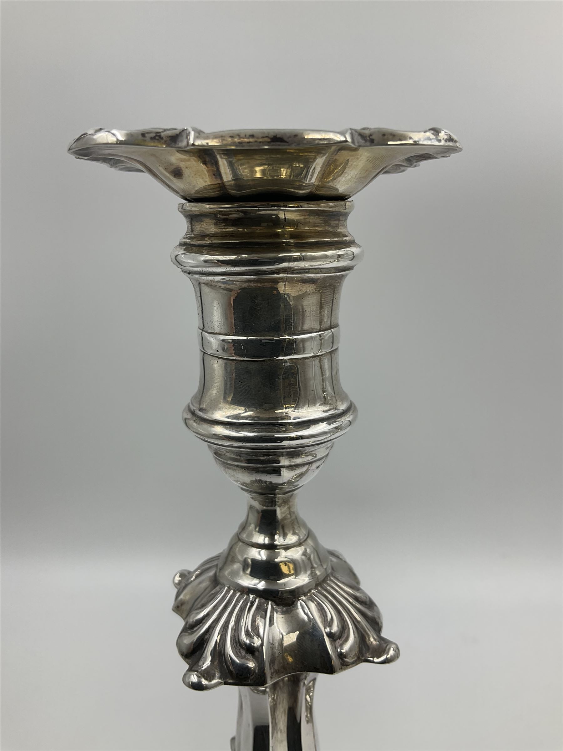 Pair of late Victorian silver mounted candlesticks, each of knopped and part fluted form, upon square stepped base with anthemions to each corner, with conforming sconces, hallmarked to removable sconces and foot, Thomas A Scott, Sheffield 1901, H25.2cm