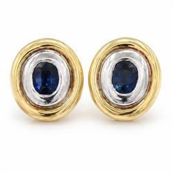 Pair of 14ct gold synthetic sapphire earrings and pendant, each rubover set with a single oval cut sapphire, within a white and yellow gold oval surround