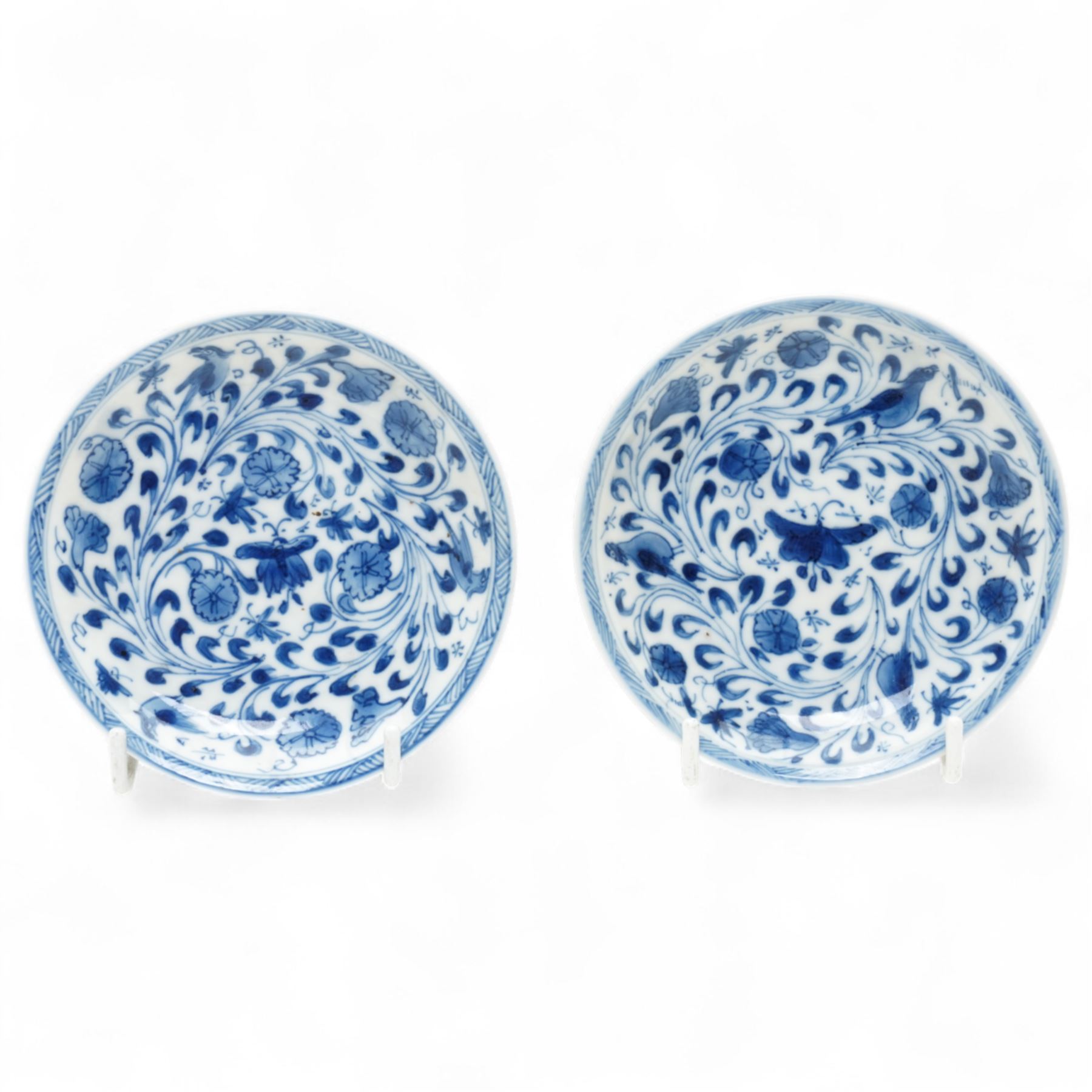 Set of six Chinese blue and white saucers, mostly Kangxi period, comprising matching pair decorated with insects and birds, example with painted lions and tigers, four bearing blue painted 'lingzhi' fungus mark to base, the others unmarked (6)