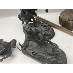 Spanish carved figure of Don Quixote, holding a book, base stamped 'Ouro, together with two spelter figures and one other