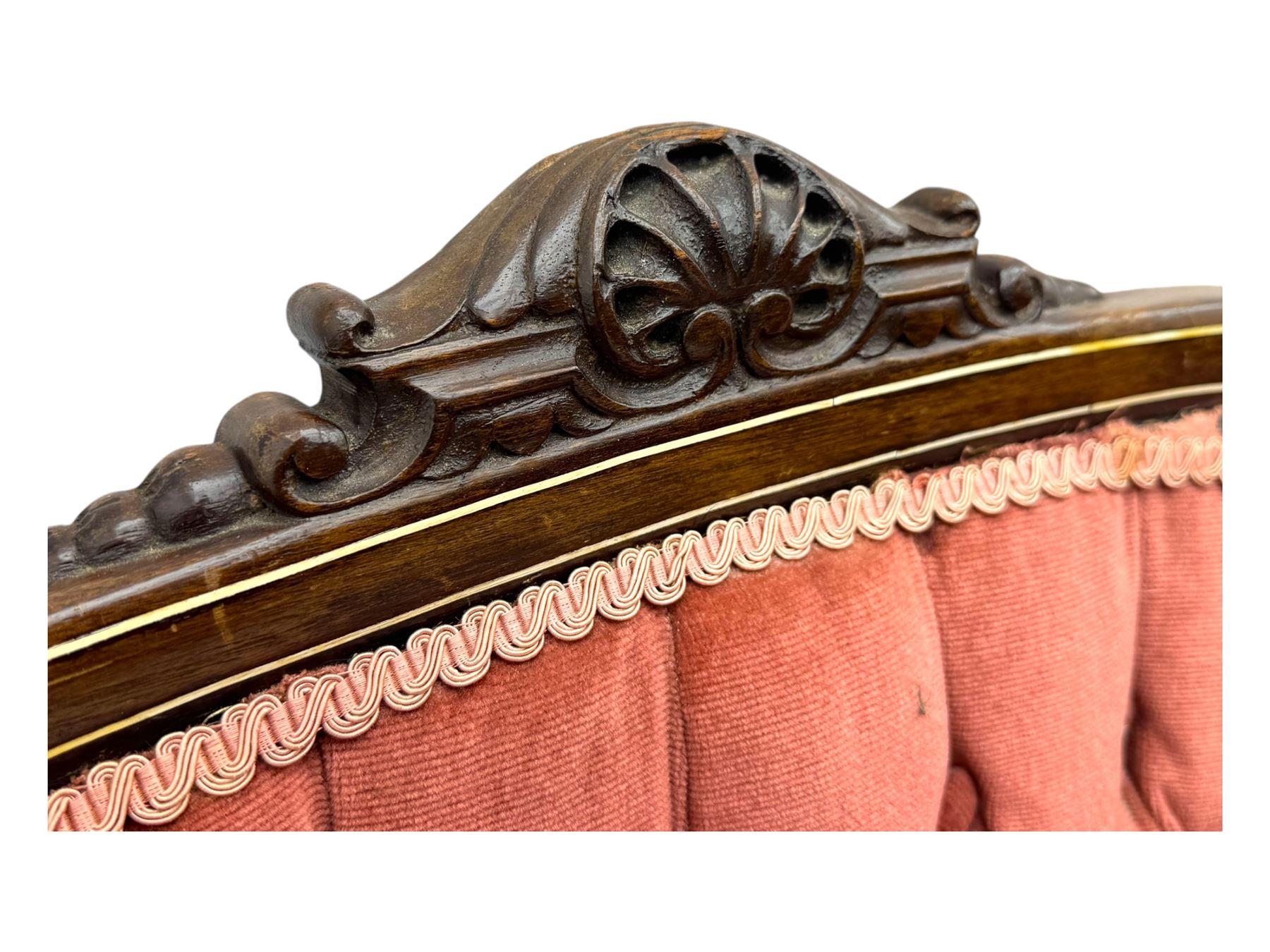 Edwardian inlaid rosewood parlour suite, comprising pair of tub shaped armchairs (W77cm, D69cm, H88cm); and matching two-seat sofa (W112cm, D69cm, H88cm), each with carved crest rails with shell motifs, deep button-tufted oval backs upholstered in pink fabric with braid trim, on cabriole supports