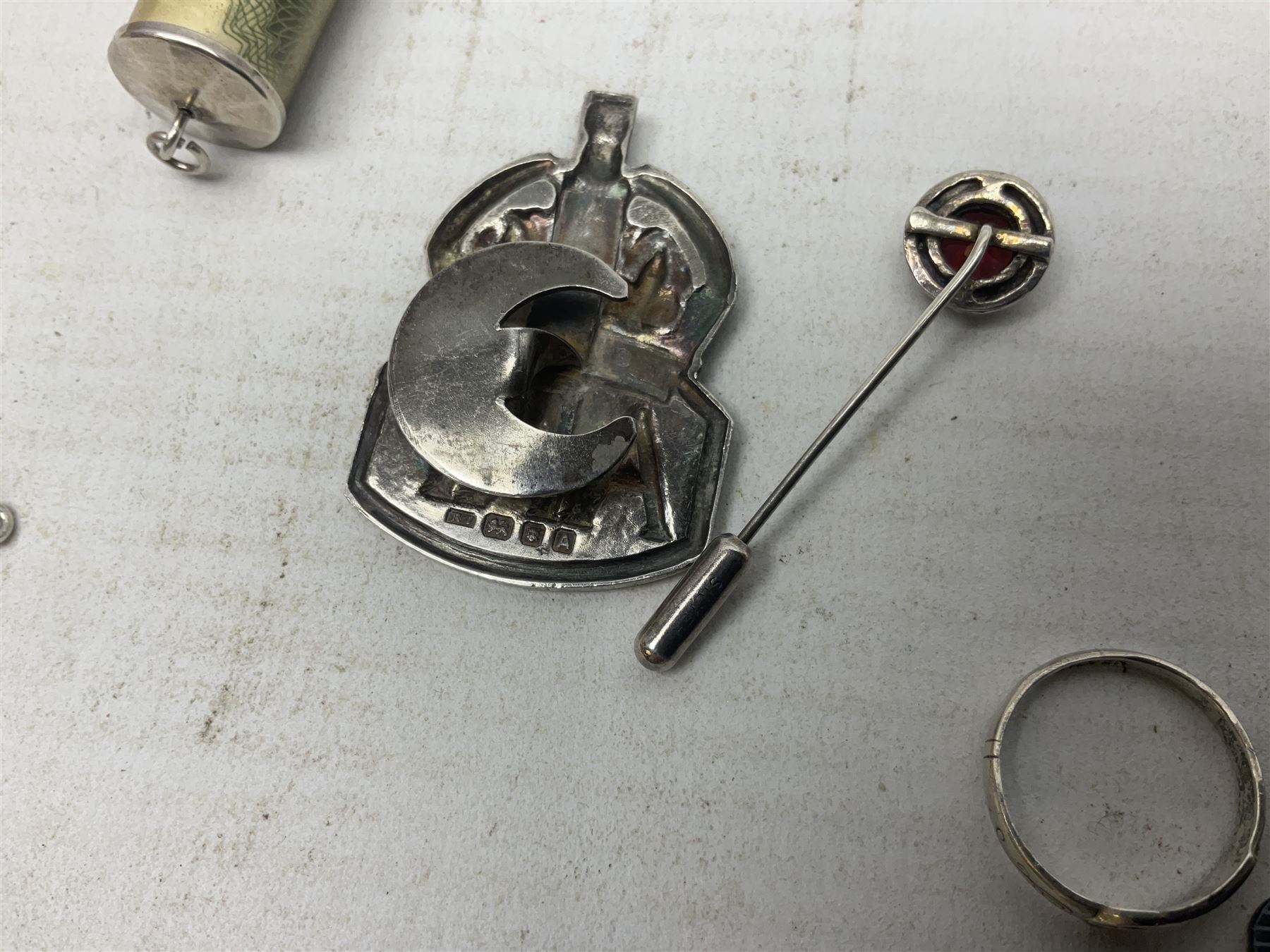 Silver mother of pearl handled fruit knife, silver jewellery including masonic pendant necklace, shell pendant, coin ring, Claddagh ring and charms etc, and a collection of ingots