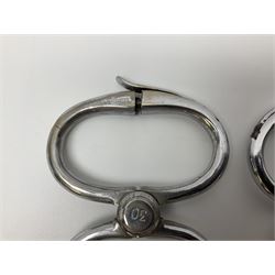 Police - two pairs of steel nipper handcuffs, one stamped Hull City Police; two other chromium plated Hiatt steel nipper handcuffs, each stamped HCP (?Hull City Police); and a pair of chromed steel articulated handcuffs stamped WRC (?West Riding Constabulary) (5)