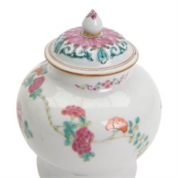 Chinese Qianlong period famille rose porcelain jar and cover, of small squat baluster form with domed cover and knop finial, finely enamelled in the famille rose palette with peony blooms, flowering prunus and bamboo issuing from pierced rockwork, upon a white glazed ground, with underglaze blue double ring mark beneath, H15cm

Provenance: From the collection of Andrew Chichester Everitt.