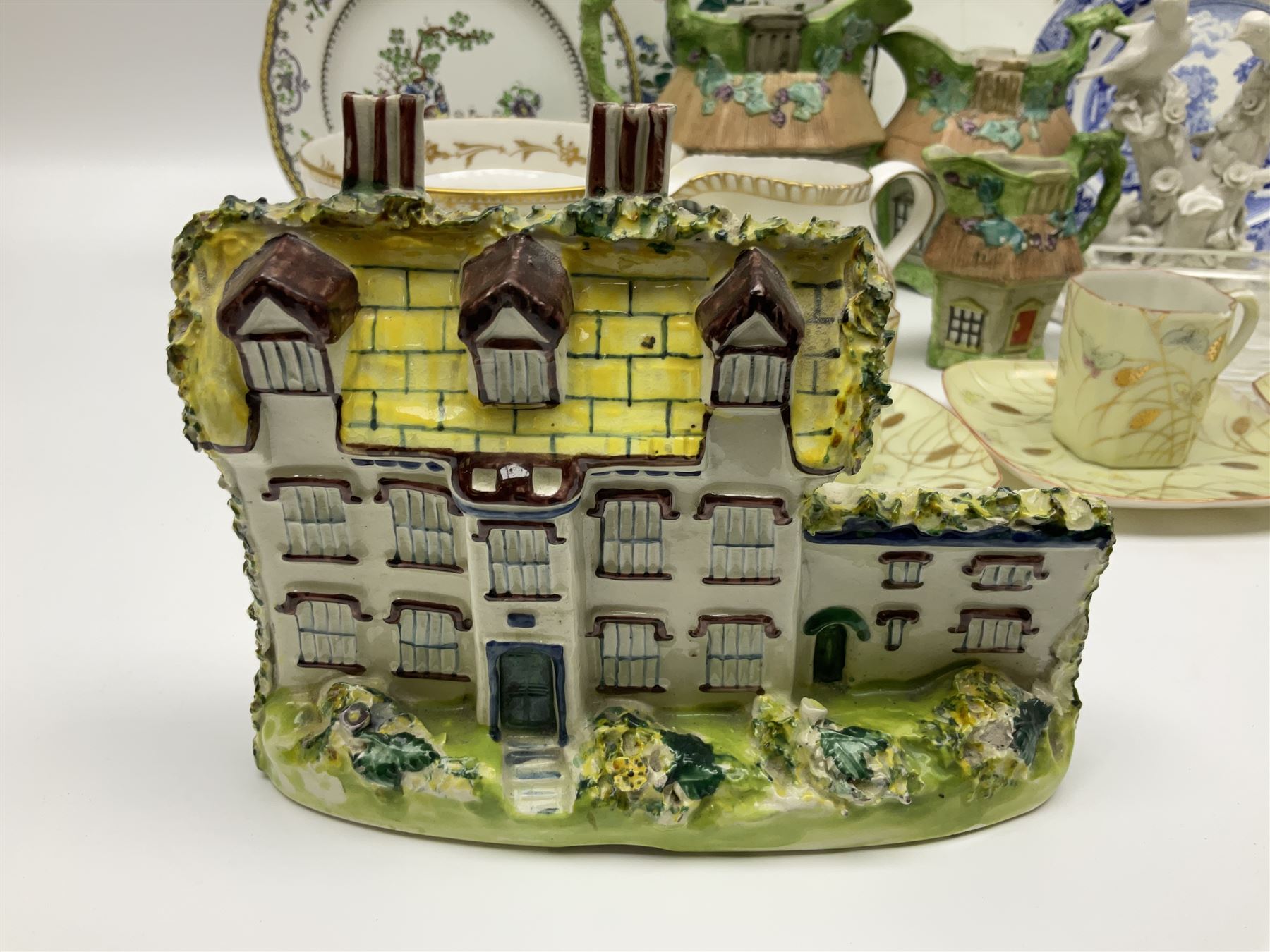 Royal Crown Derby Brocade pattern jug and sugar bowl, together with a similar gilt floral pattern bowl, three graduating Staffordshire style pearlware cottage jugs, Leeds Pottery model cottage and other ceramics and glassware, etc