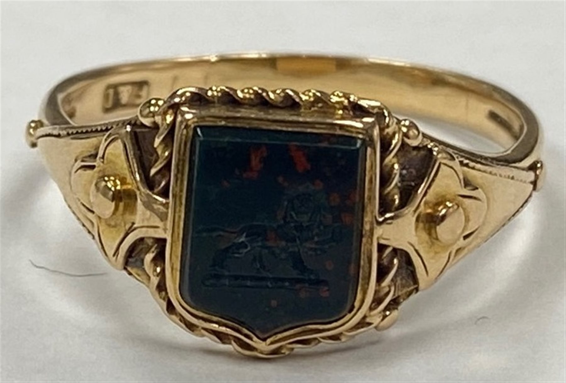 Victorian 15ct gold bloodstone lion intaglio, shield shaped signet ring and a 9ct gold agate dragon intaglio ring