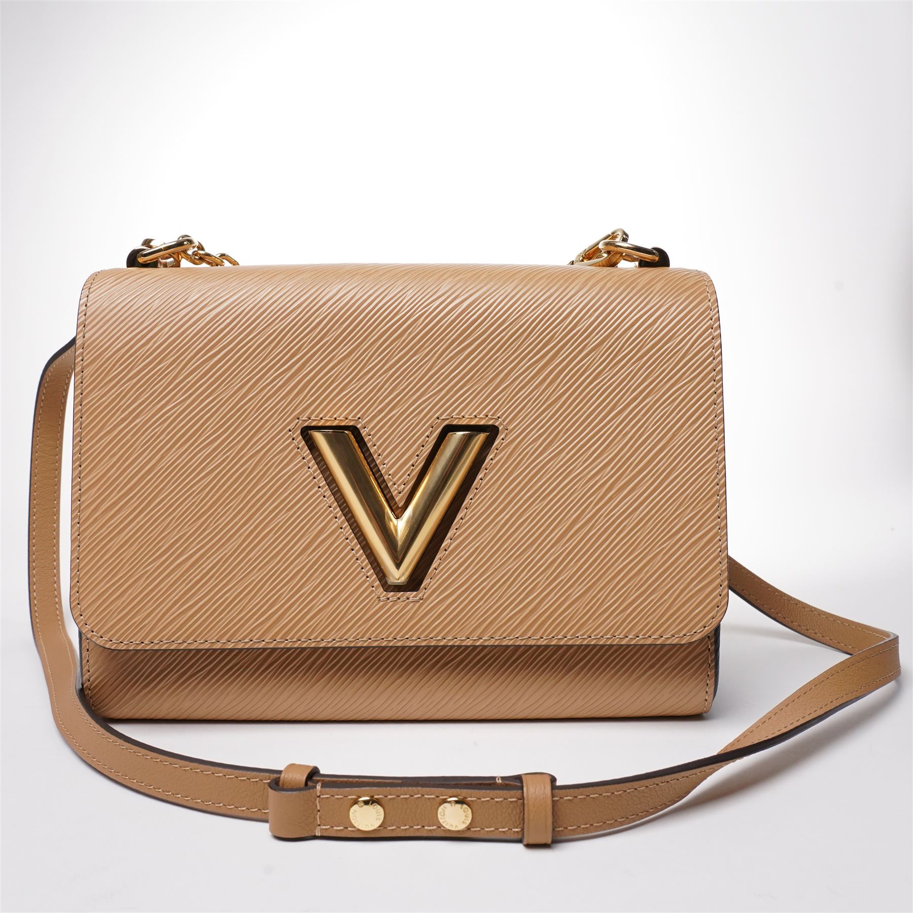 Louis Vuitton - ‘Twist’ MM Bag, the model introduced for the Cruise 2015 collection under Nicolas Ghesquière, in structured beige Epi cow hide leather with black sides, with gold-tone signature LV monogram twist-lock fastening and chain carrying handle, with detachable flat leather shoulder or crossbody strap, unused with original box and dust bag