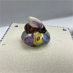 Clarice Cliff for Wilkinson Ltd Crocus Bizarre beehive honeypot painted in the Crocus pattern, together with two beehive Beswick honey pots, Poole square honey pot etc (14)