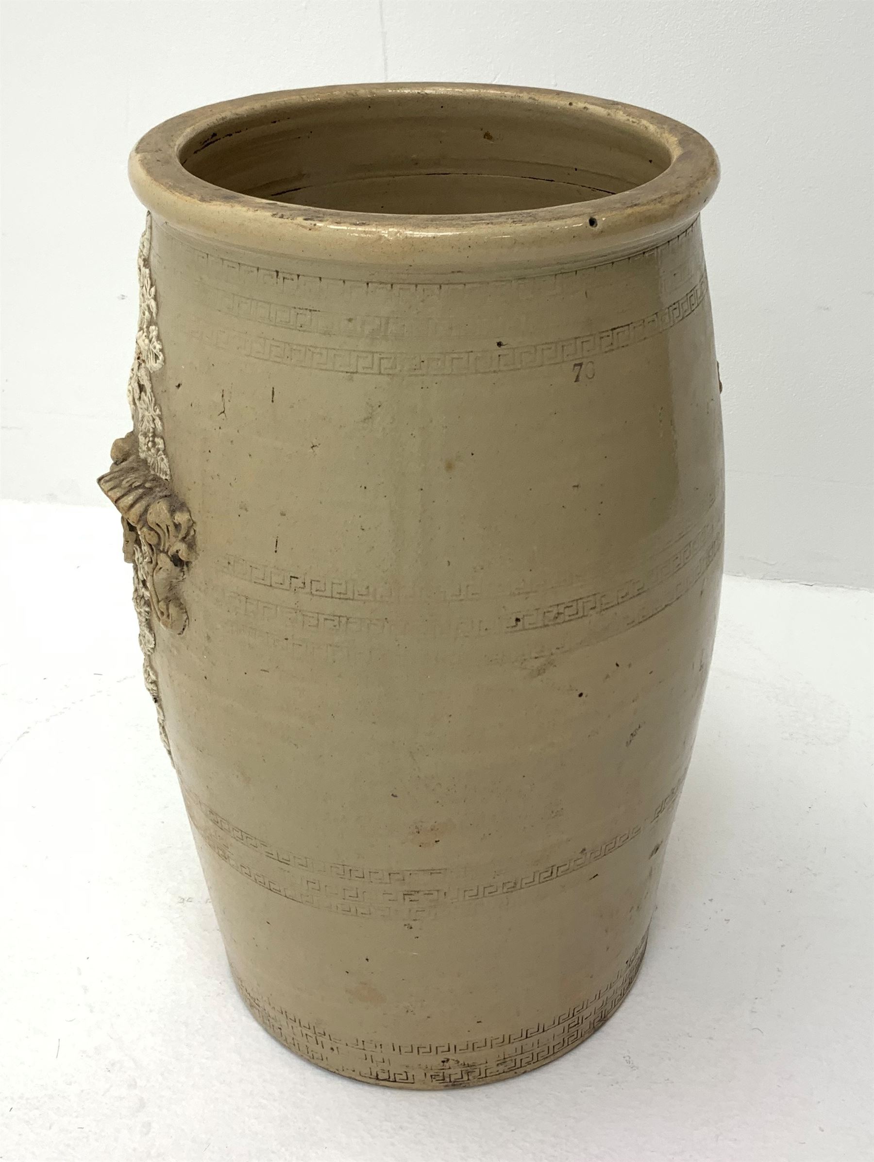 A Victorian Lipscombe & Co stoneware water filter, the body with twin scrolled lug handles, and applied fruiting vine decoration to the front, with applied maker's plaque detailed Lipscombe & Co Patentees 233 Strand Temple Bar London, H54cm. 