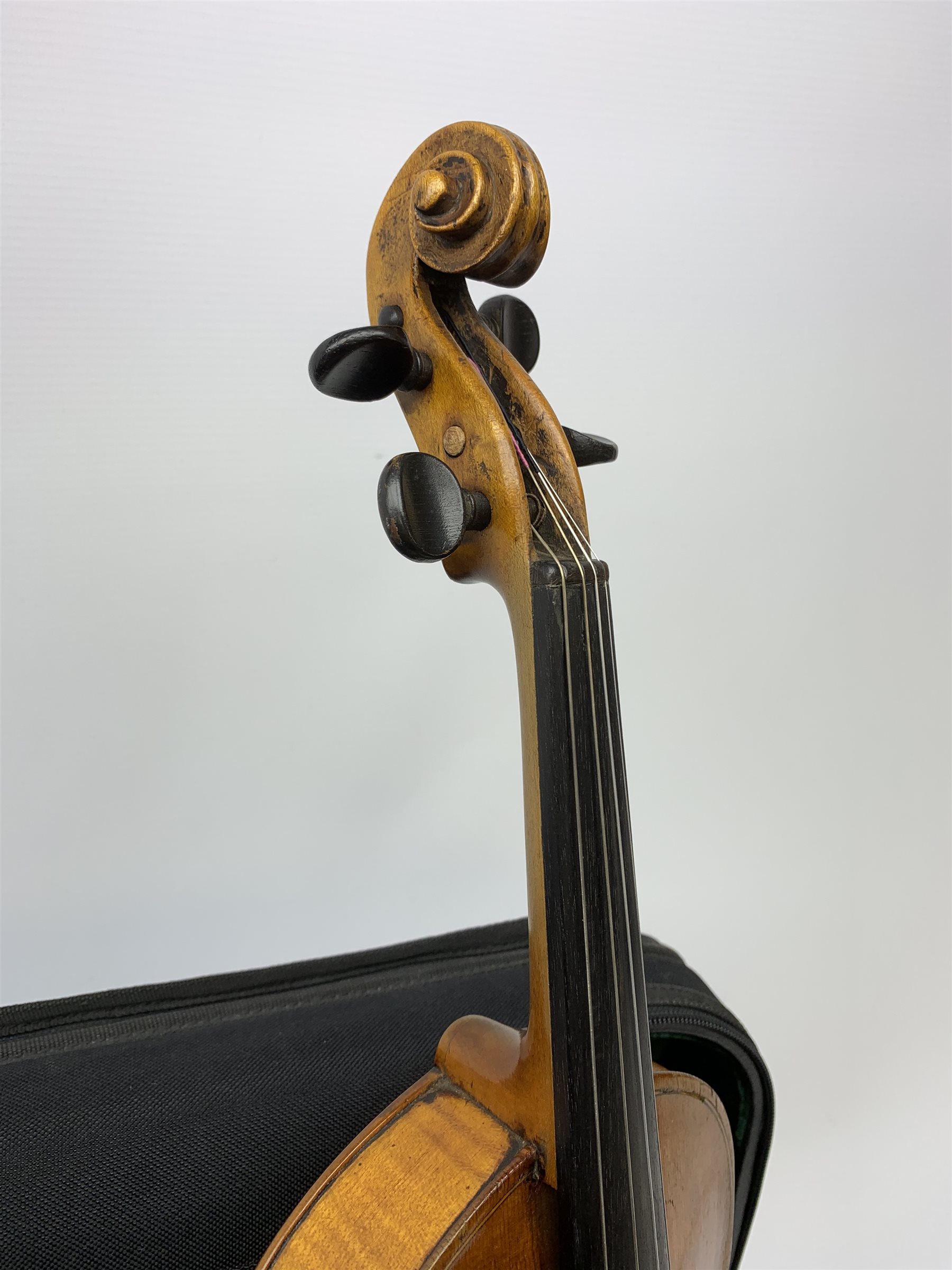 Late 19th century continental violin, possibly Italian, with 36cm two-piece maple back and ribs and spruce top, bears label 'Antonius Stradivarius Anno 1721', 60cm overall; in modern carrying case with silver mounted pernumbuco bow
