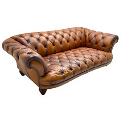 Tetrad - 'Oskar' grande three-seat sofa, Chesterfield shape with rolled arms, upholstered in buttoned tan leather, on turned and reed moulded feet 