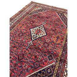 North West Persian Hamadan carpet, the extended lozenge field decorated with Herati motifs, central lozenge medallion, multiple border bands decorated with geometric designs 