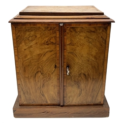  Victorian figured walnut and tulipwood banded table top cabinet, two doors enclosing three drawers having sunken brass carry handles embossed with a London Coat of Arms and Victorian Registration Kite mark, L30cm, H32.5cm, D21.5cm  