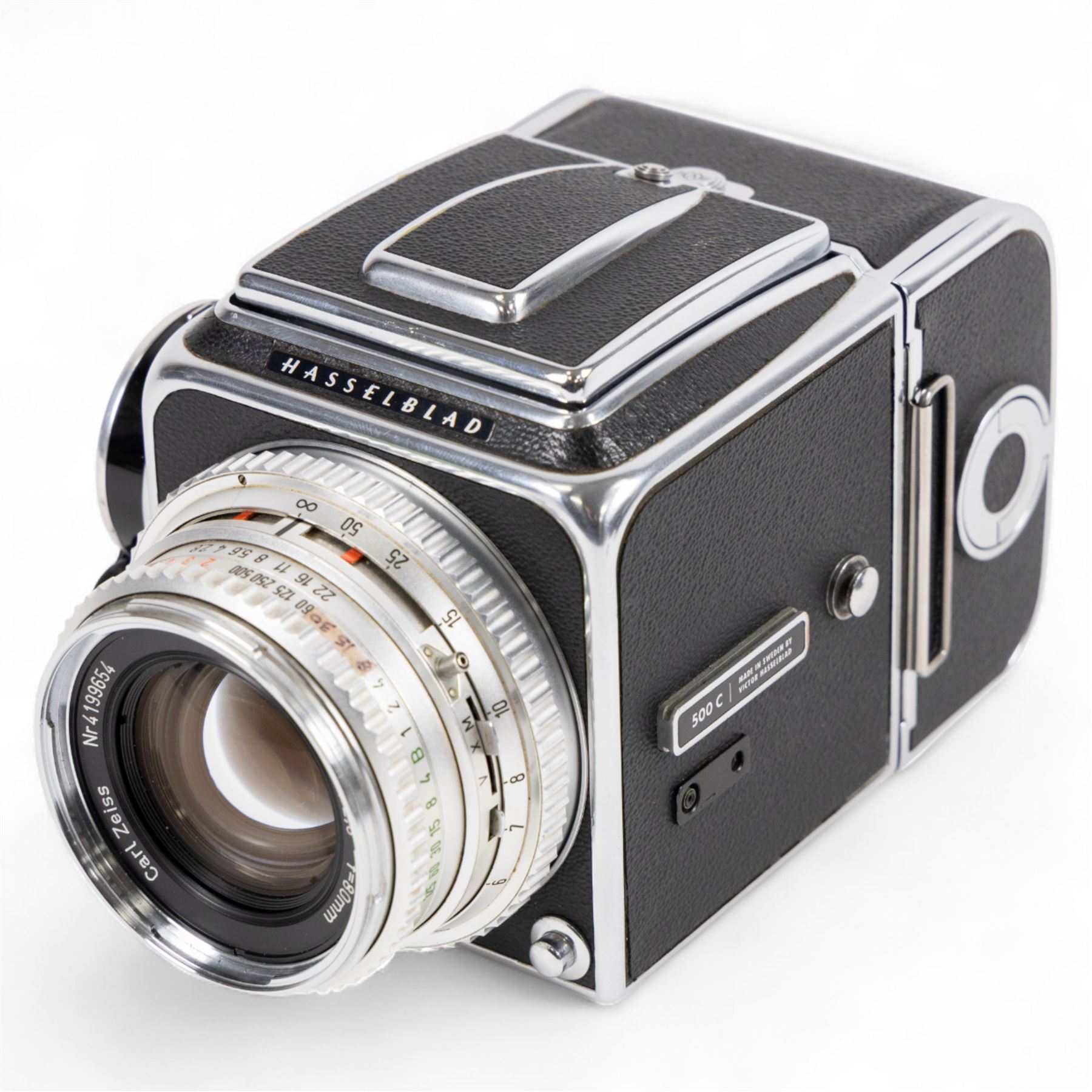 Hasselblad 500C medium format camera, serial no. TC60836, circa 1965, with Carl Zeiss Planar 1:2.8 f=80mm lens with cap, serial no. 4199654, one film back, serial no. TC87300 and a Hasselblad PM5 prism viewfinder serial no. 401EE1335