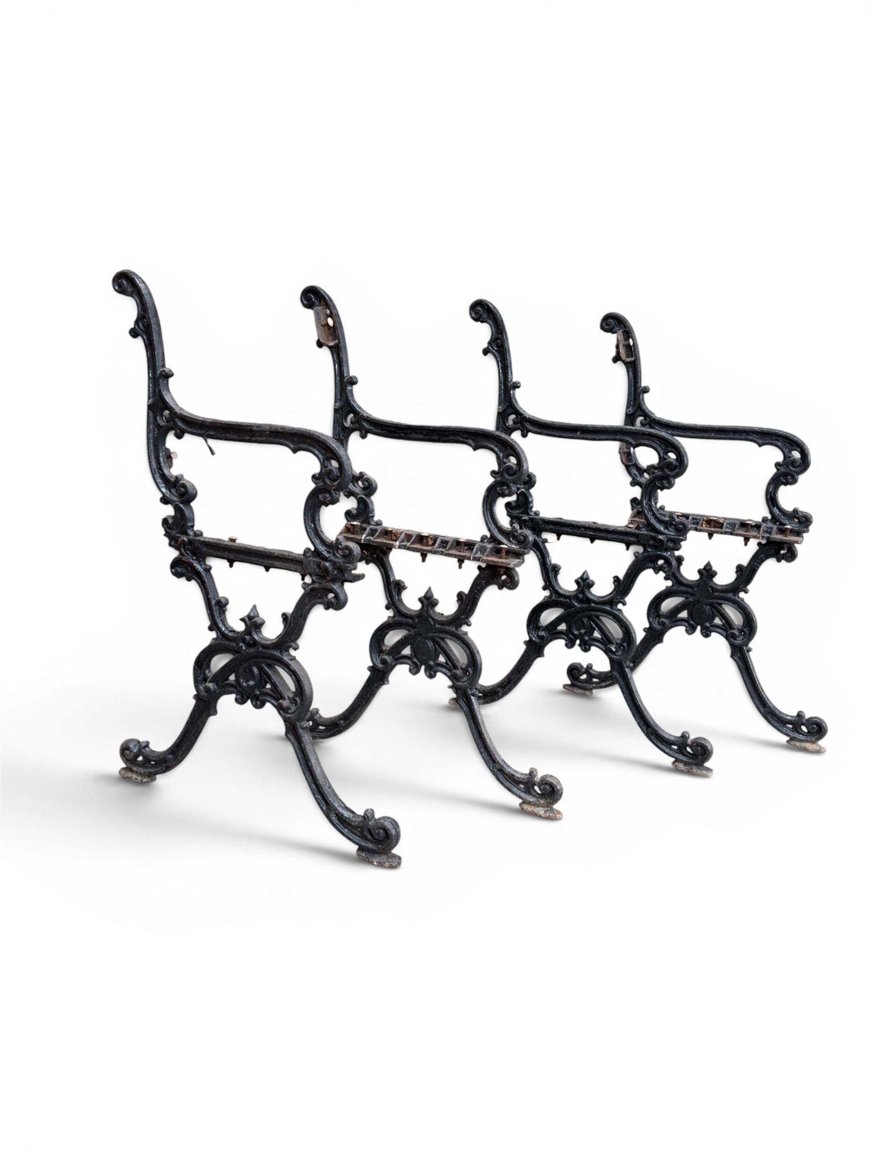 Carron Foundry - two pairs of 19th century cast iron garden bench ends, ornate detail with arms and X shaped legs,finish in black paint, the design no. 110396, first registered 13 July 1857 (see illustration), width as desired