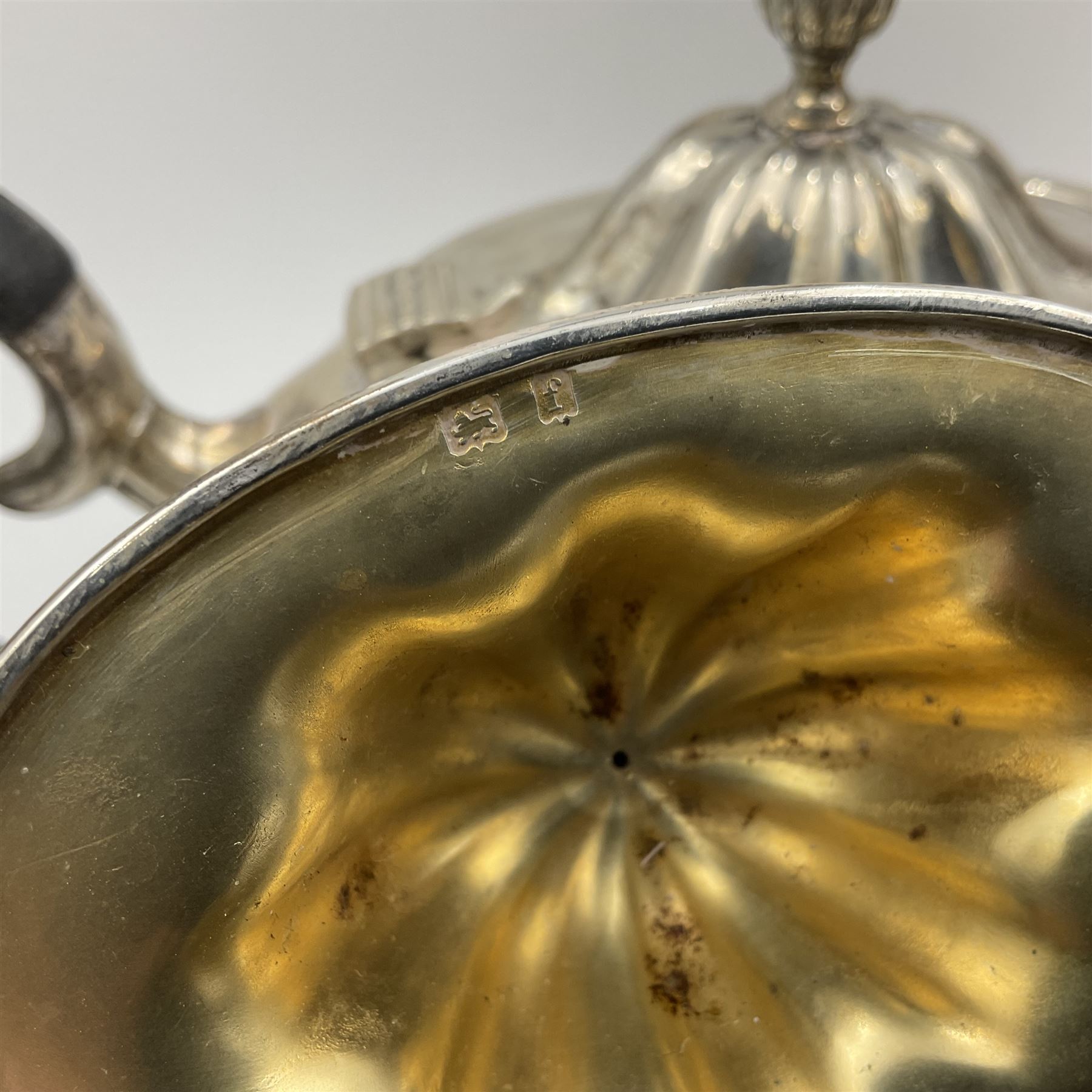 Five piece Edwardian silver tea service, comprising teapot and coffee pot, each with ebonised scroll handle, tea caddy with hinged cover, twin handled open sucrier, and milk jug, each of rounded bombe form, upon four paw feet, hallmarked William Adams Ltd, Birmingham 1904 and 1905, coffee pot H26cm
