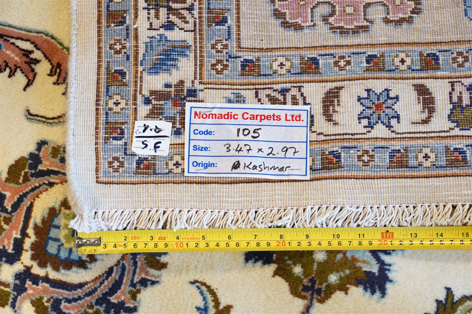 North East Persian Mashad hand-knotted carpet, ivory field decorated with an all-over scrolling floral vine design incorporating stylized palmettes, deer, rosettes and floral sprays enclosed by a conforming floral vine border between multiple guard stripes, cotton fringe ends