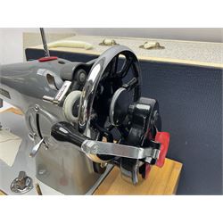 Seamstress sewing machine in case, together with a Singer sewing book