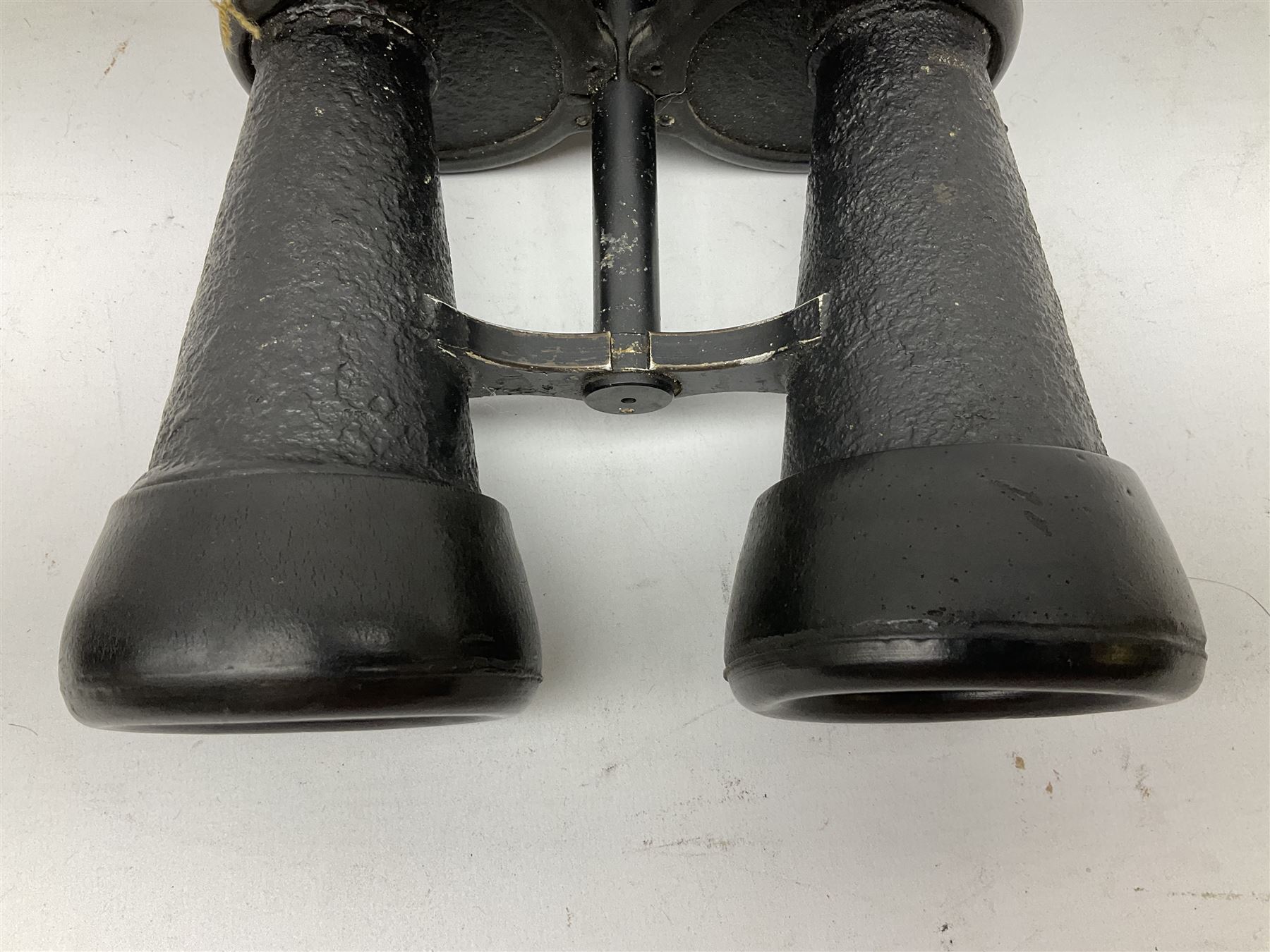 Pair of WWII German U-boat binoculars probably 7 x 50 by Leitz, with rubber eye piece protector covers and leather case stamped with Kriegsmarine mark to the lid and dated 1944, with leather strap.