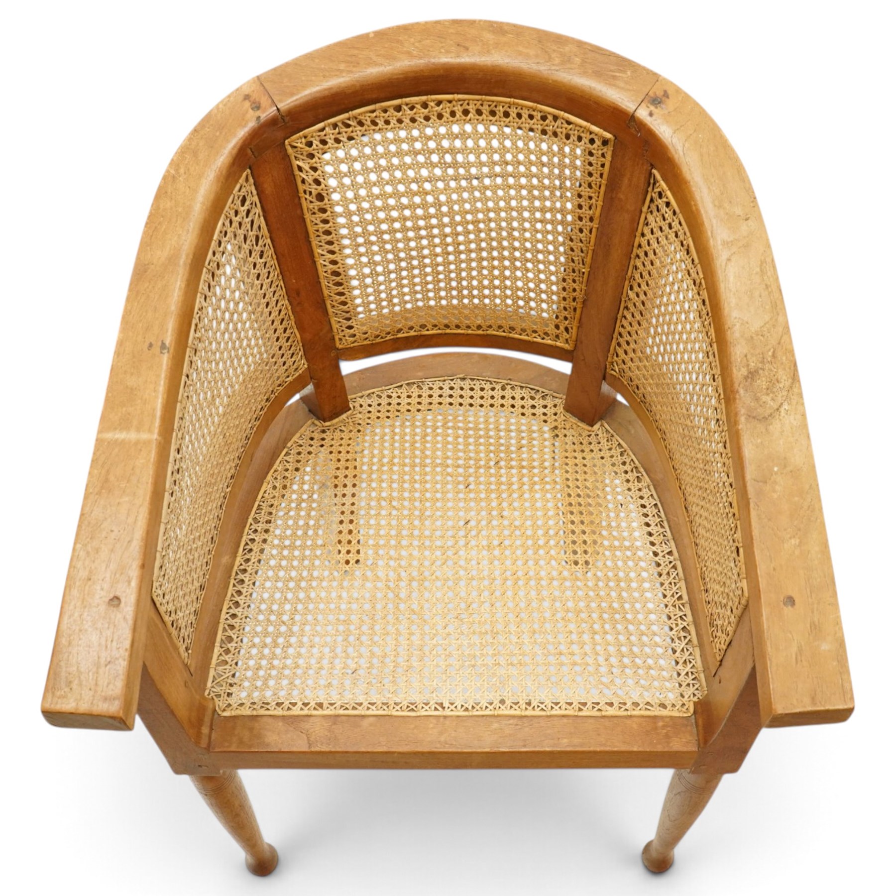 Late 20th century Anglo-Indian teak framed bergère armchair with canework back and seat, raised on tapering supports
Provenance: purchased Liberty & Co in the 1990s from the oriental line