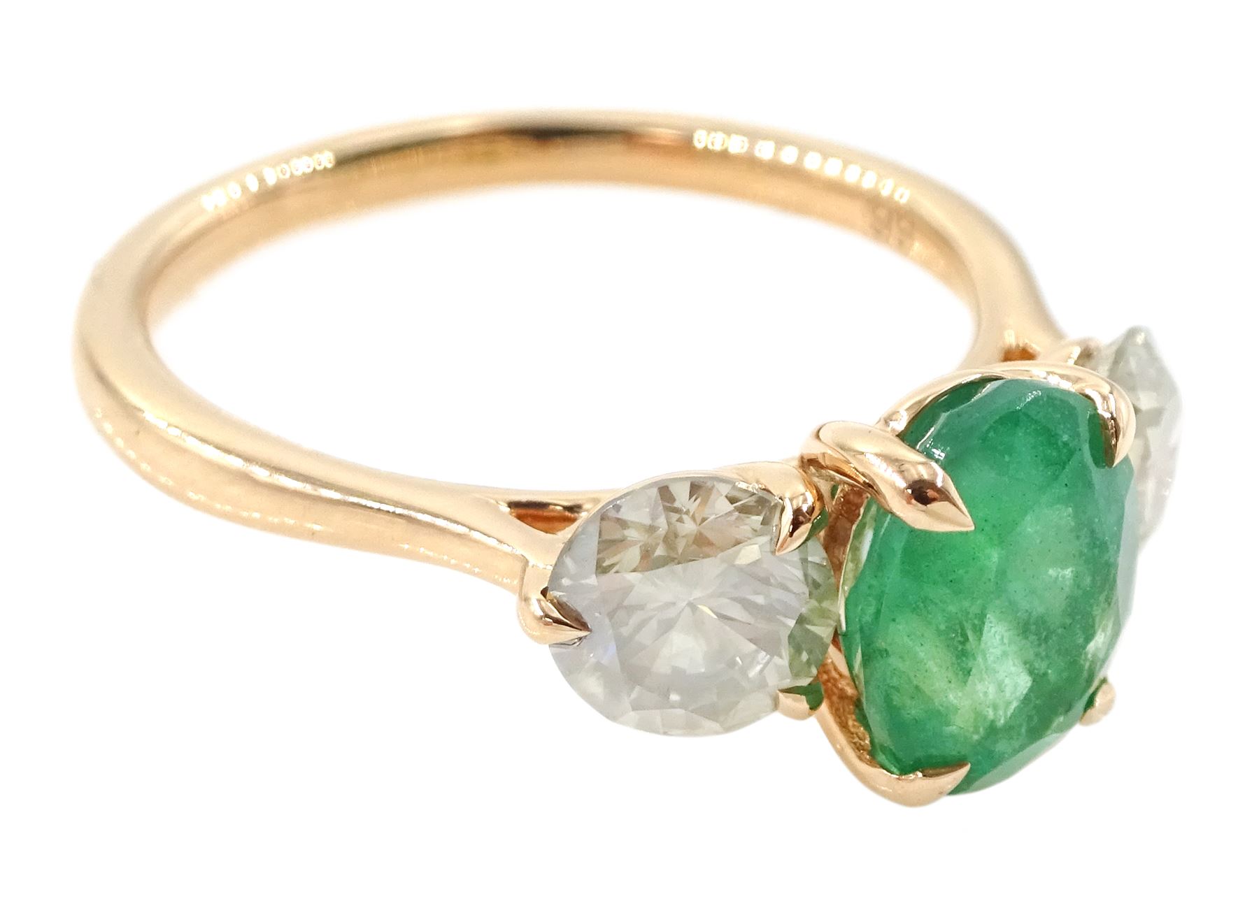 18ct rose gold three stone emerald and diamond ring, single oval cut emerald of approx 1.80 carat, with a round brilliant cut diamond set either side, hallmarked, total diamond weight approx 1.20 carat