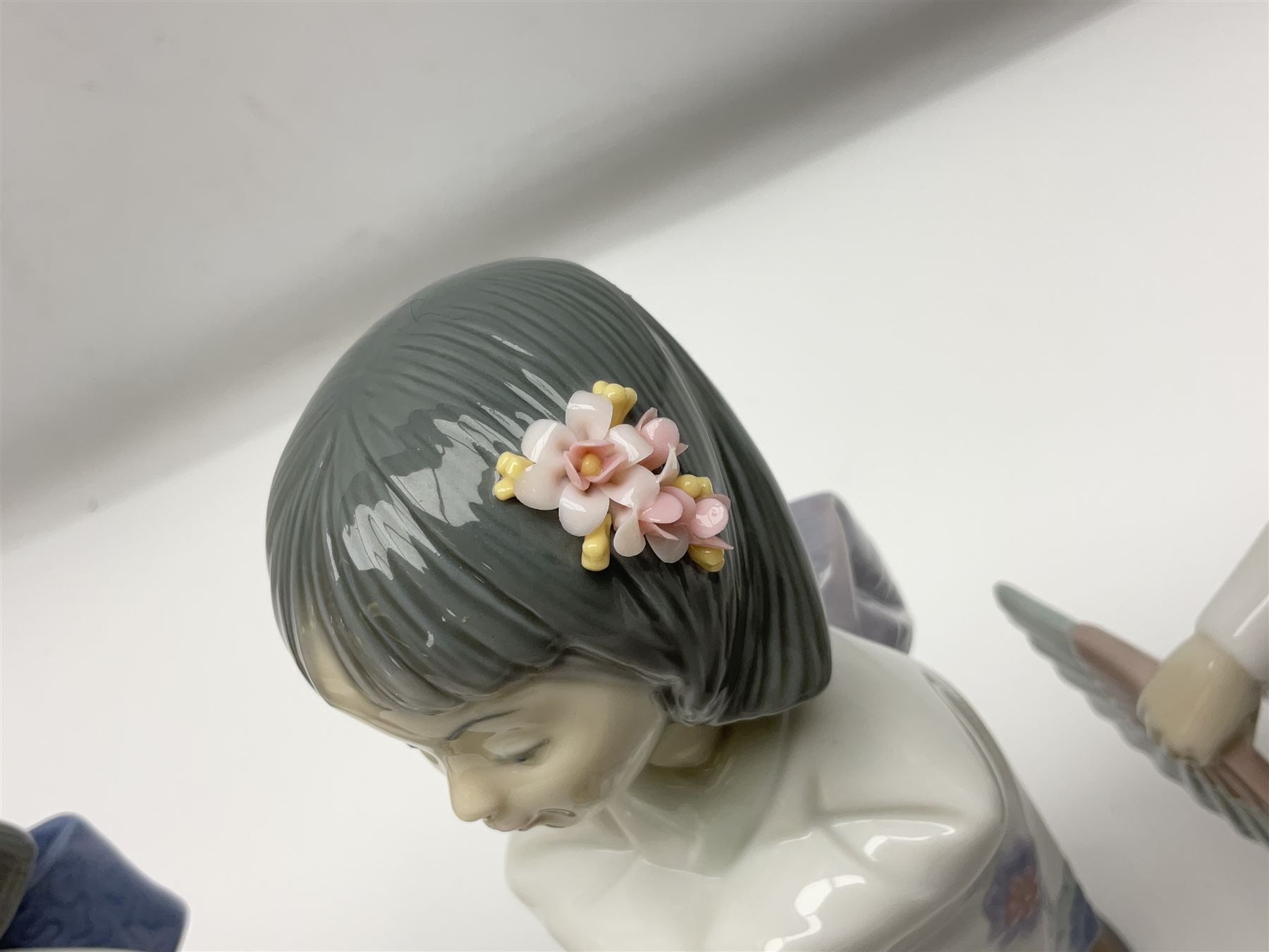 Six Lladro figures of the China doll set and Oriental doll set, comprising Playing the Flute no.6150, Bearing Flowers no.6151, Flower Gazer no. 6152, Oriental Dance no. 6230, Oriental Lantern no. 6231 and Oriental Beauty no. 6232, largest H20cm