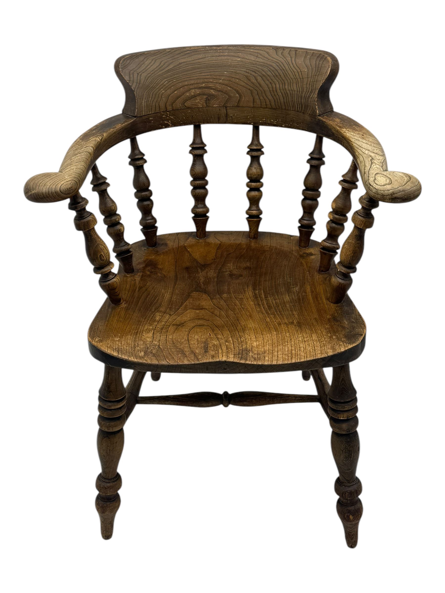 19th century elm and beech smoker's bow armchair, shaped arms over turned spindle gallery and dished seat, on turned supports united by double H-shaped swell turned stretchers 