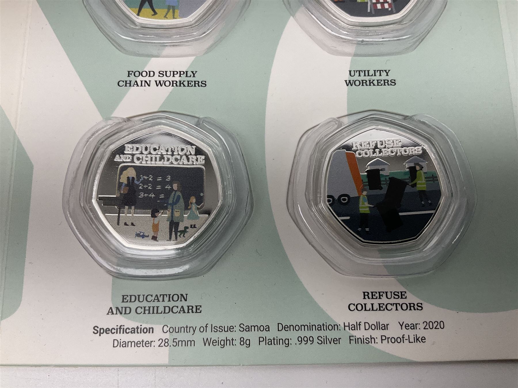 'Thank You To Our Key Workers Official Charity Coin Collection' comprised of fourteen Queen Elizabeth II Samoa half dollar coins including one minted in fine silver, the others being plated, housed in the official folder
