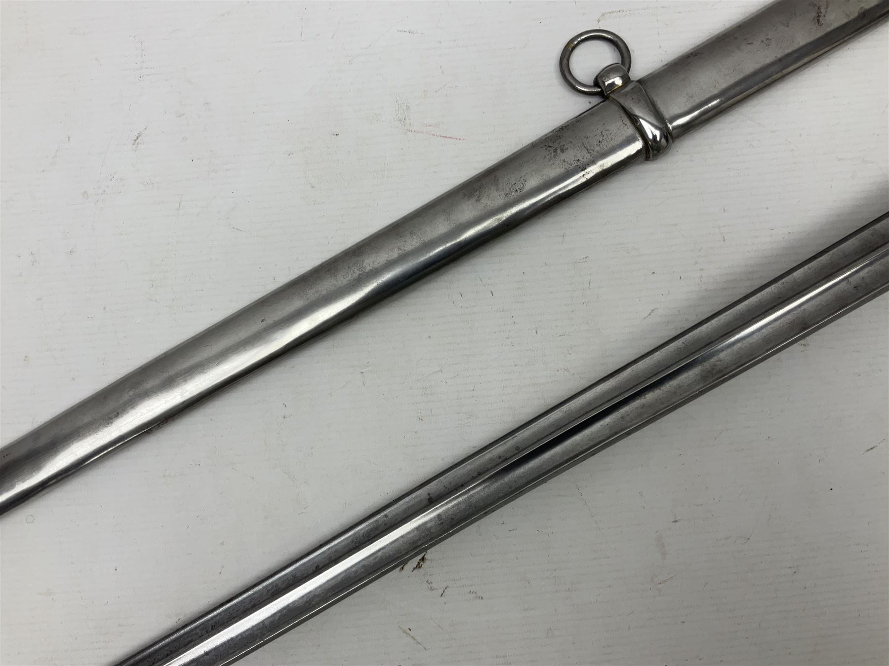 Early 19c French 1st Empire Heavy Cavalry trooper's sword, the 95.5cm double fullered blade with various stamped marks and inscribed Klingenthal 1814 to the back edge, four-bar brass hilt with wire-bound leather grip, knucklebow numbered 139; in polished steel scabbard with two suspension rings L117cm overall