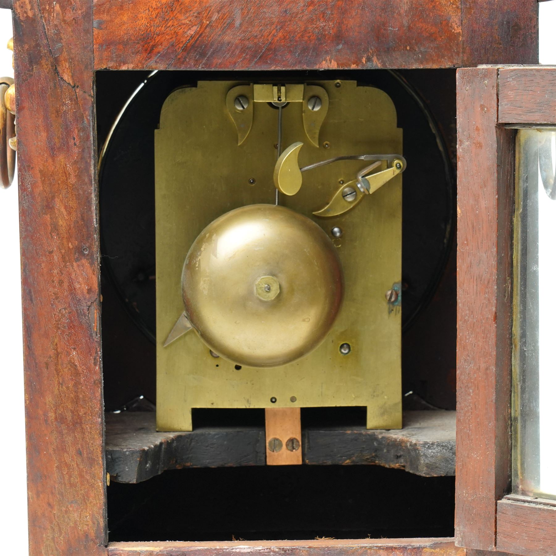 William IV mahogany and brass mounted bracket clock, the rectangular case with swept pagoda top with acanthus carved and rosette applied decoration, the sides with circular pierced brass fabric covered apertures and brass carrying handles, dial with 8 inch painted Roman chapters with pierced steel hands, the brass four pillar twin wire fusee 8-day movement with anchor escapement striking on a bell, lacking pendulum 