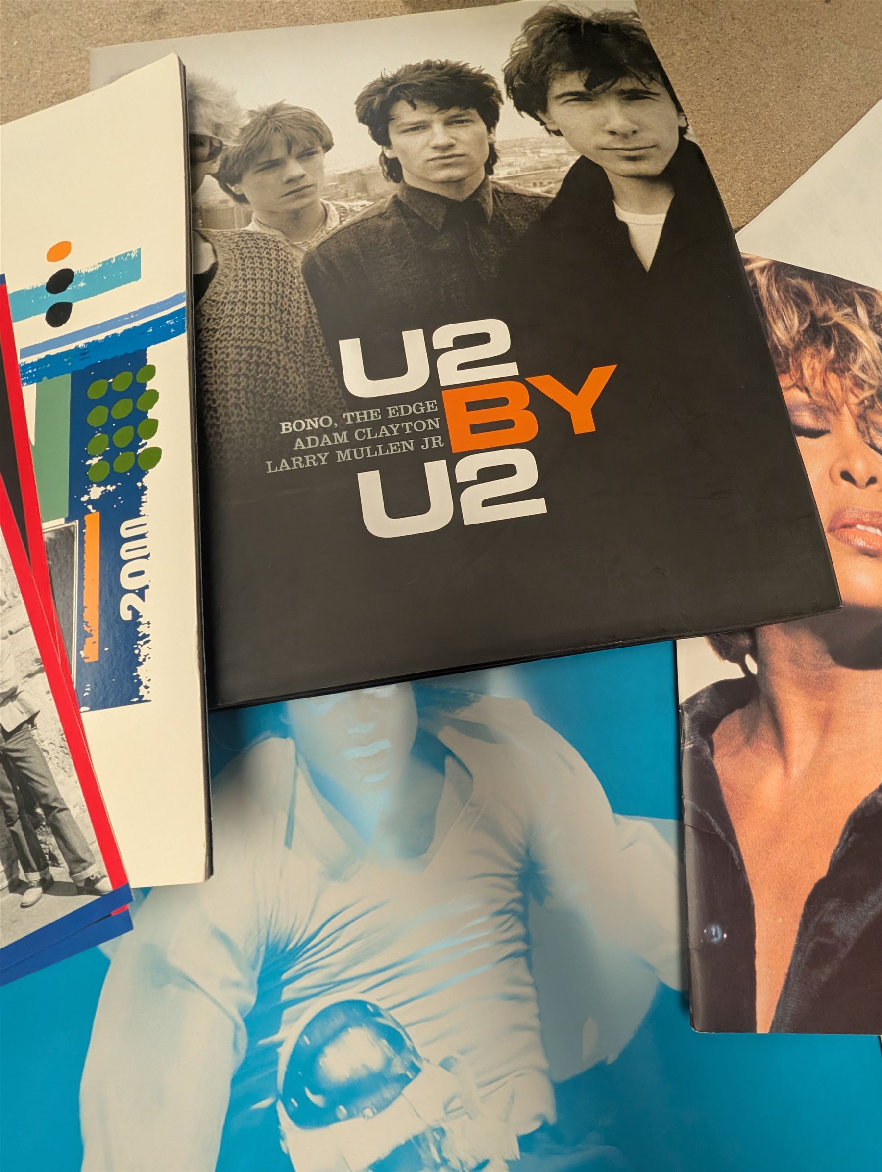 Music memorabilia, comprising signed photographs, including Leo Sayer and Suzie Quattro,  tour programmes, including Rod Stewart and Tina Turner, U2 book, two metal Michael Jackson posters and photographs 