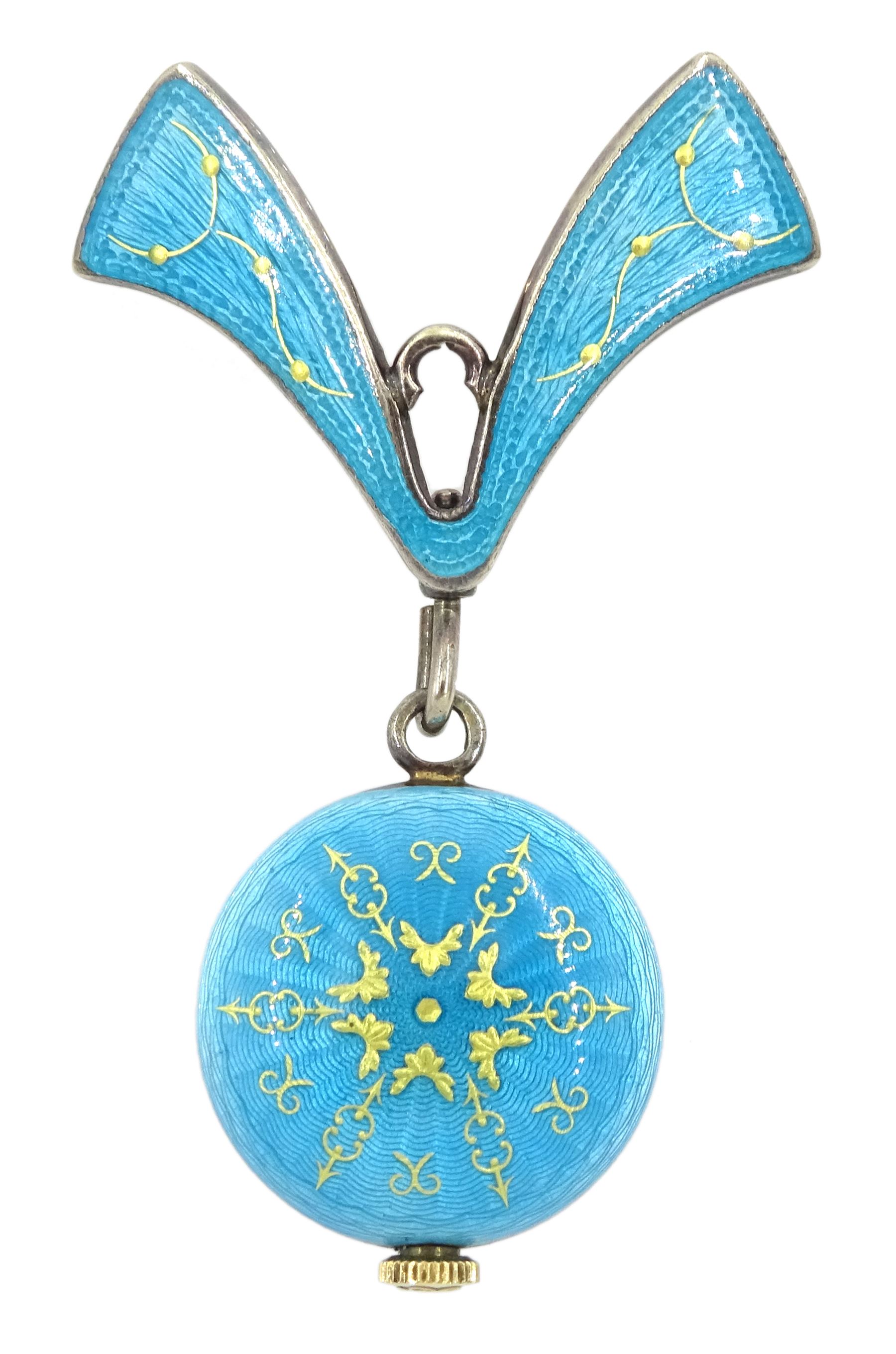 Nadine Swiss silver and enamel fob watch, silvered circular dial with baton markers, cased in blue guilloche enamel with gilt decoration, suspended from a matching brooch